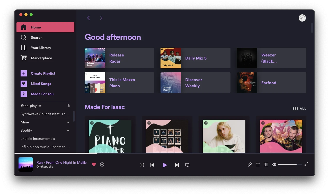 Spotify with Sleek Elementary theme — a minimal dark interface with warm orange accents