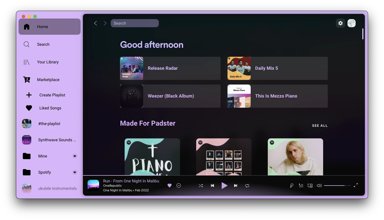 Spotify with Dribbblish theme — a colorful sidebar with gradient playbar